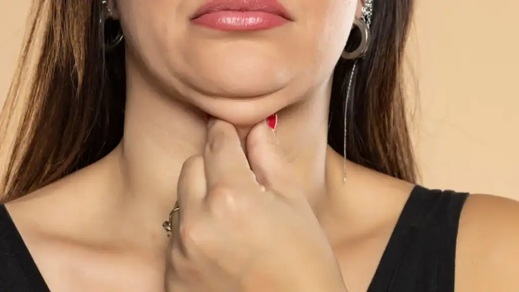 An image of a woman with double chin, sad, worried : Non Surgical Double Chin Removal Treatment in Harpenden, UK